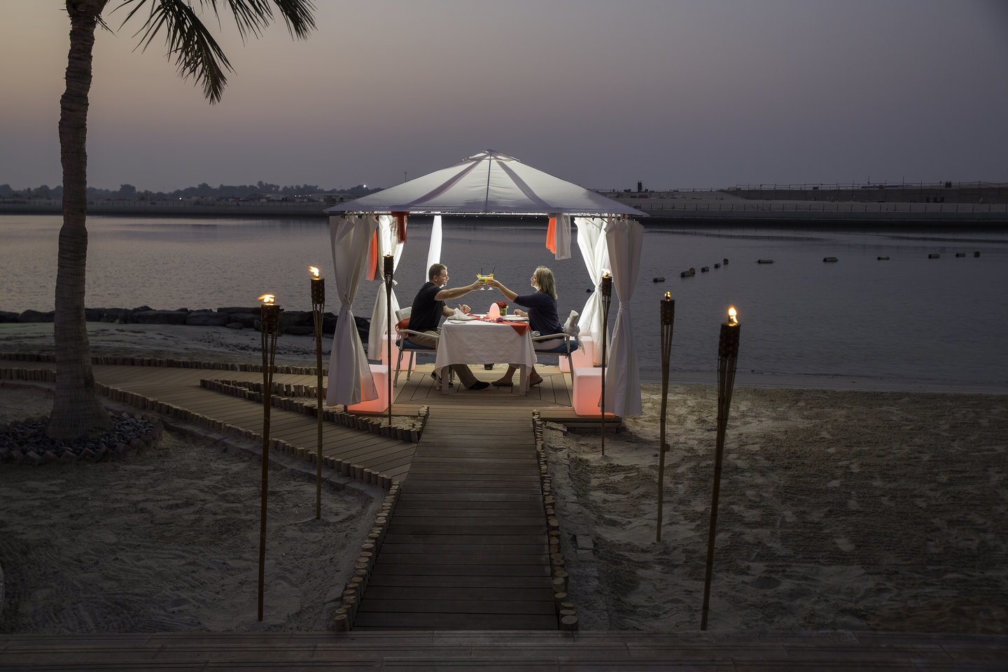 Dine under the stars at Al Raha Beach Hotel